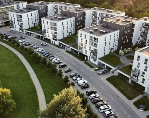 an aerial view of a city with lots of tall buildings
